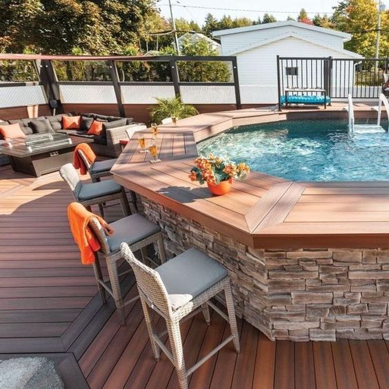 above ground pool with a deck