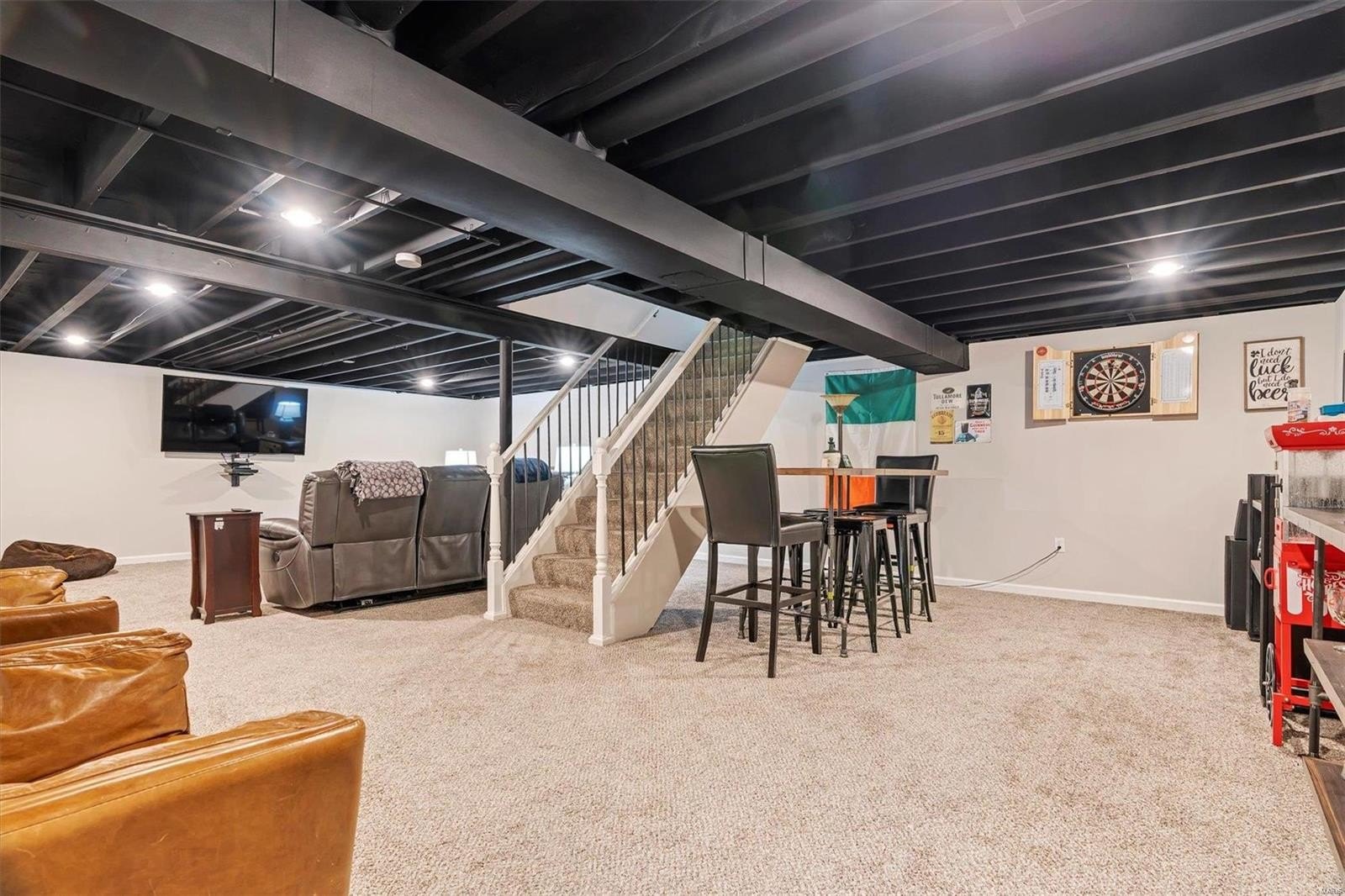Basement with black painted ceiling