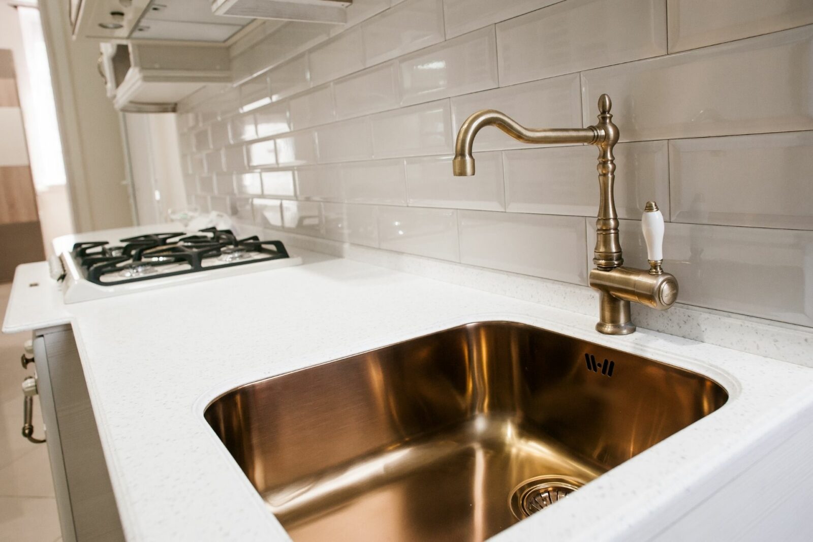 champagne bronze kitchen faucet with stainless sink