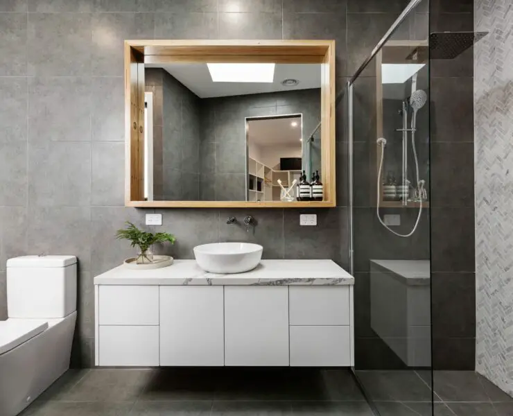 how much space between toilet and vanity