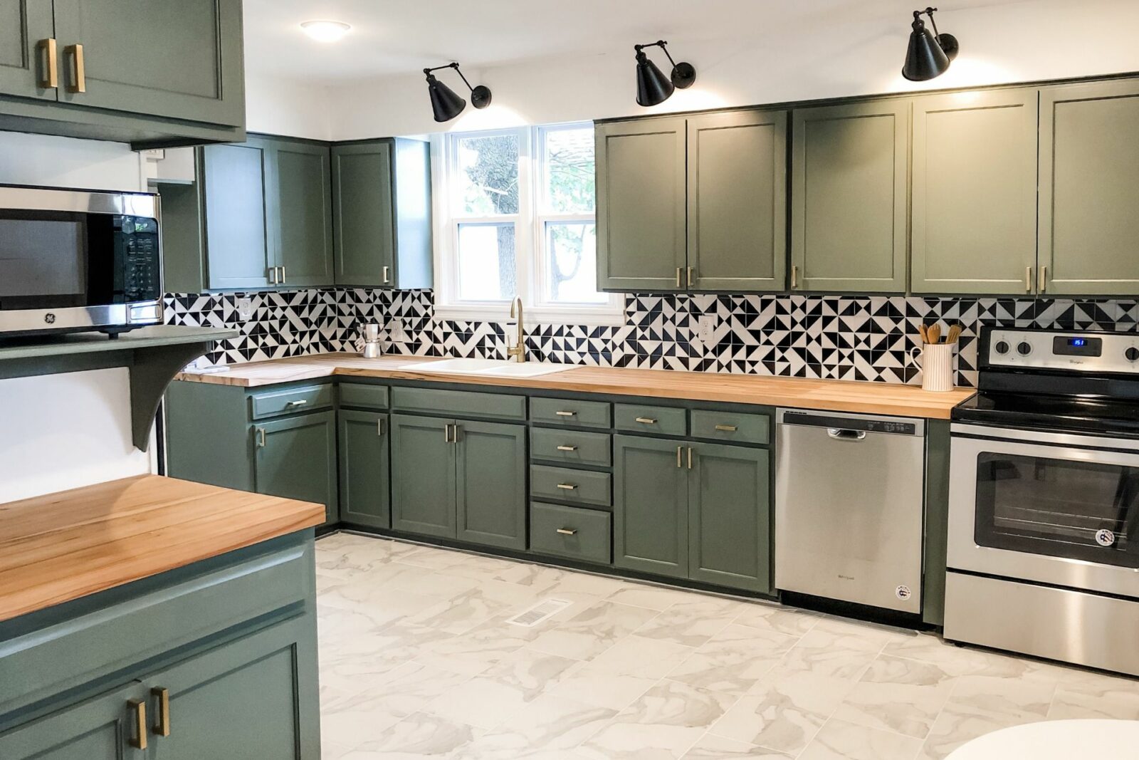 sage green kitchen cabinets with butcher block countertops