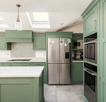 sage green kitchen cabinets with white countertops