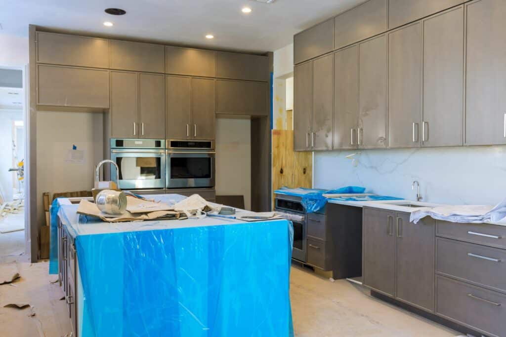Approach your kitchen remodel in stages to ease financial strain, and prioritize impactful changes like new appliances or a fresh coat of paint for immediate transformations.