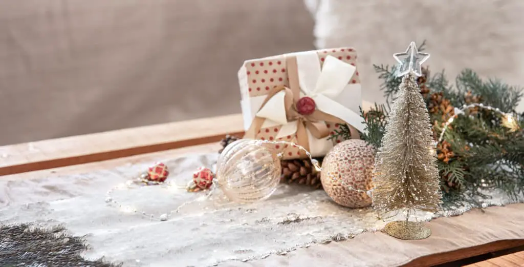Christmas background with decor details on a blurred background with bokeh lights, copy space.