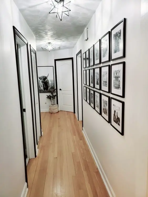 white walls and black trim, black frames