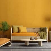 Yellow living room interior with sofa,armchair,lamp and plant
