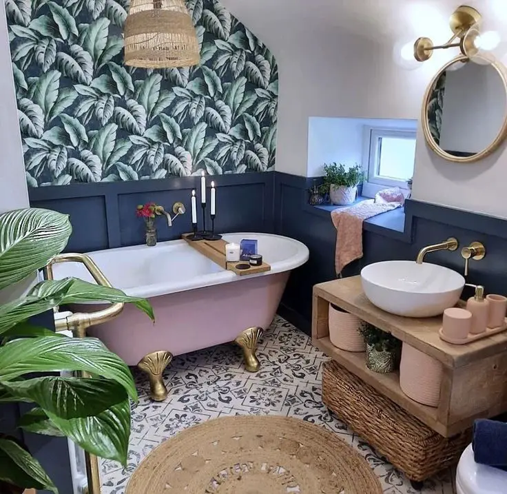 A clawfoot bathtub with a pastel exterior and golden feet can act as the centerpiece of a boho-chic bathroom, offering a vintage aesthetic that resonates with the bohemian love for eclectic and retro elements. Its standalone feature and unique color choice make a stylish statement that blends nostalgia with contemporary boho trends.