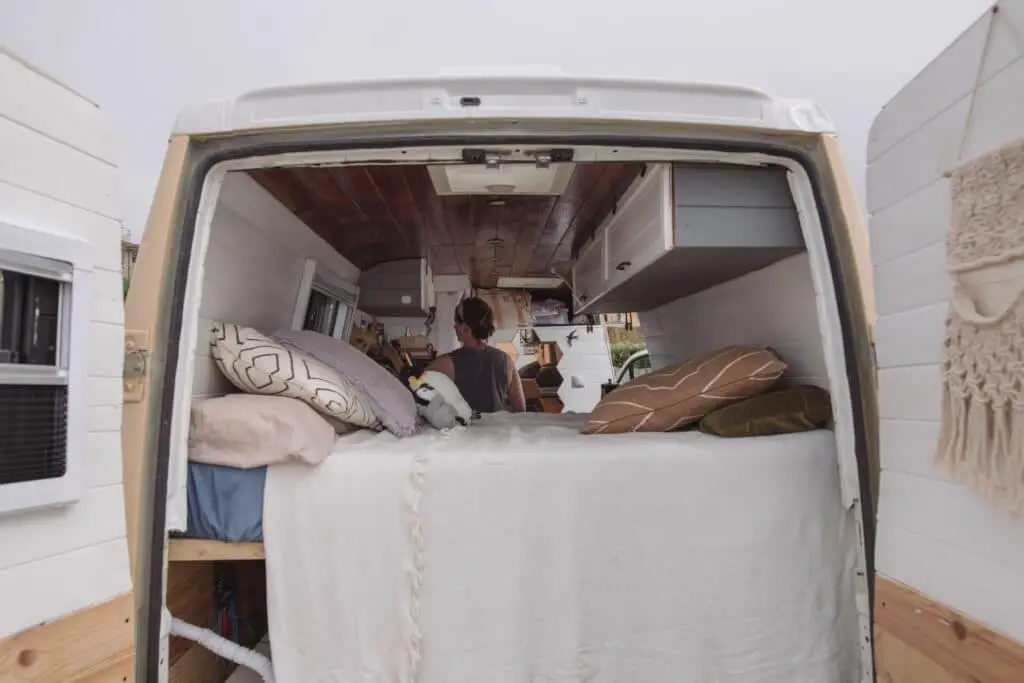 Millennials living in vans, like Michael Alberse and the couple Court and Nate, embrace sacrifices and face challenges like isolation for financial freedom, saving significantly and laying a foundation for their future despite the lifestyle's hardships.
